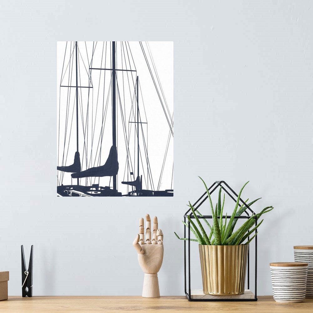 A bohemian room featuring A subdued design in white and dark blue of the masts of a couple of sailboats floating in the water.