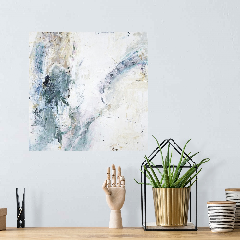 A bohemian room featuring Square abstract painting of faint textured colors such as gray, brown and white