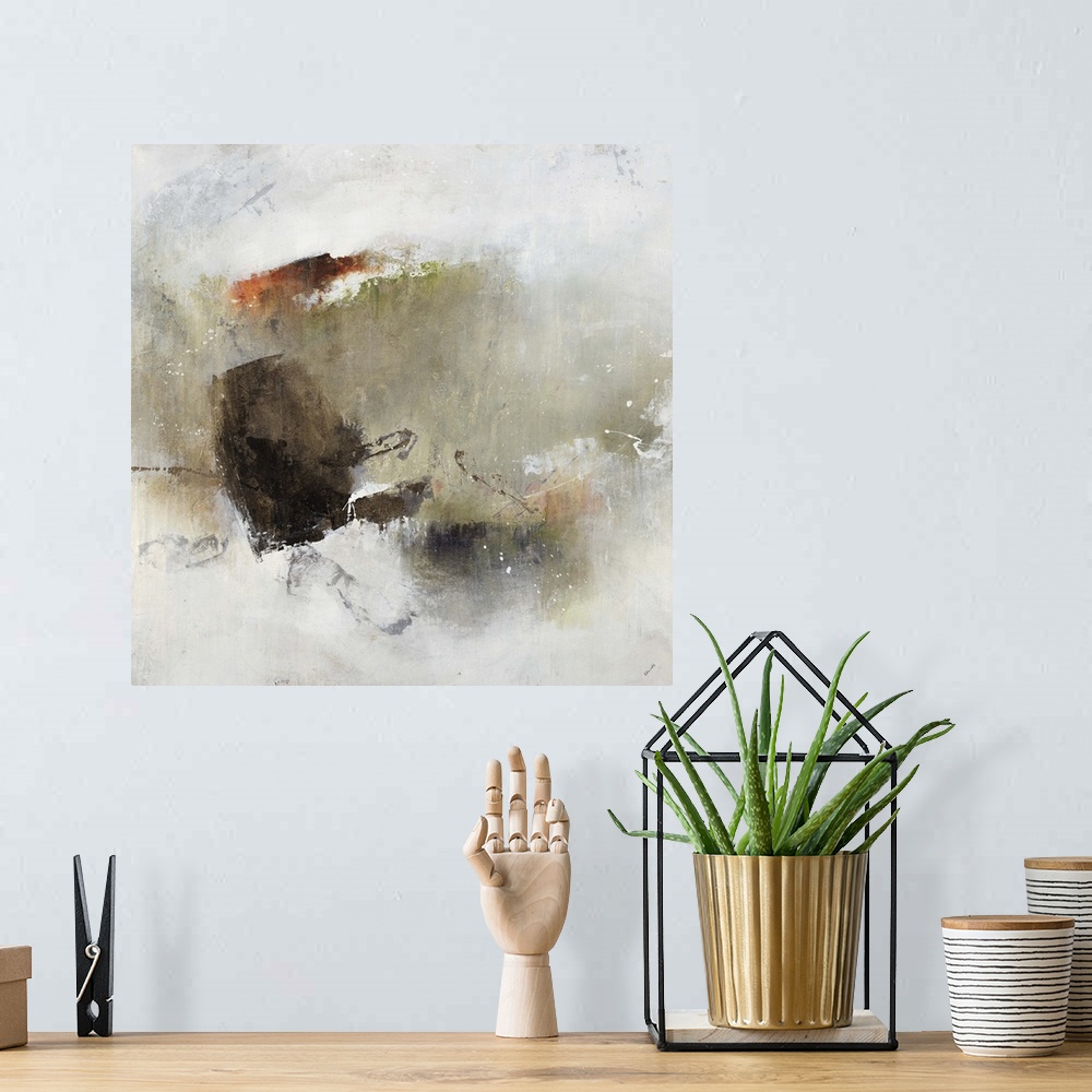 A bohemian room featuring Abstract painting of a cluster of shapes and earth tone colors with the appearance of watercolors...