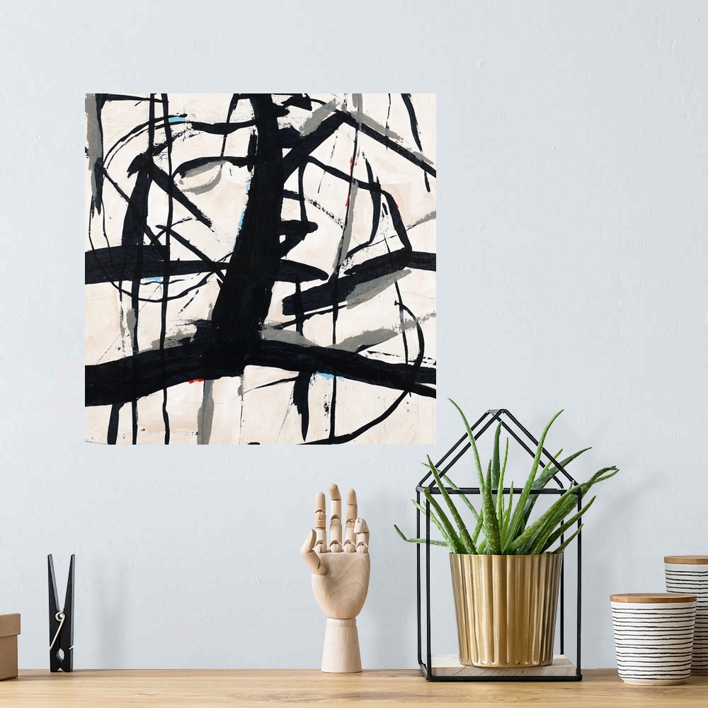 A bohemian room featuring Contemporary abstract painting using bold black lines against a neutral toned background.