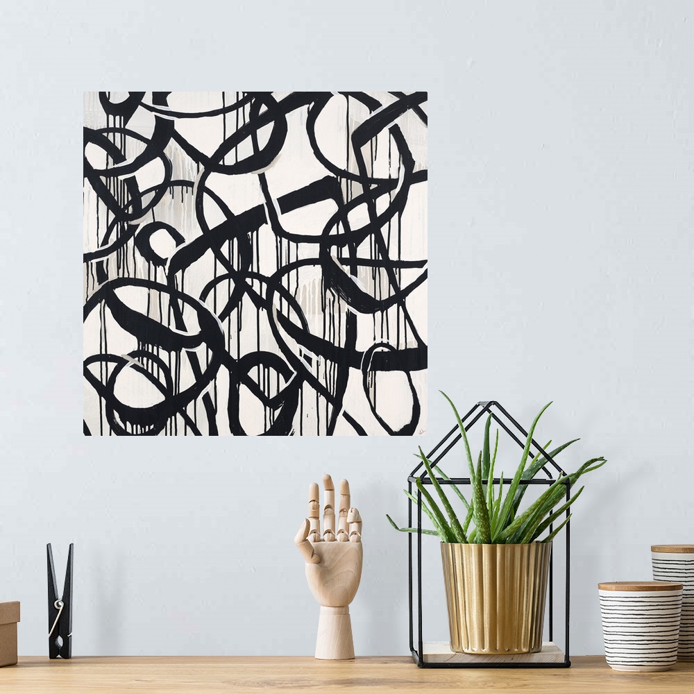 A bohemian room featuring Contemporary high contrast abstract painting using deep black organic lines in a circular motion.