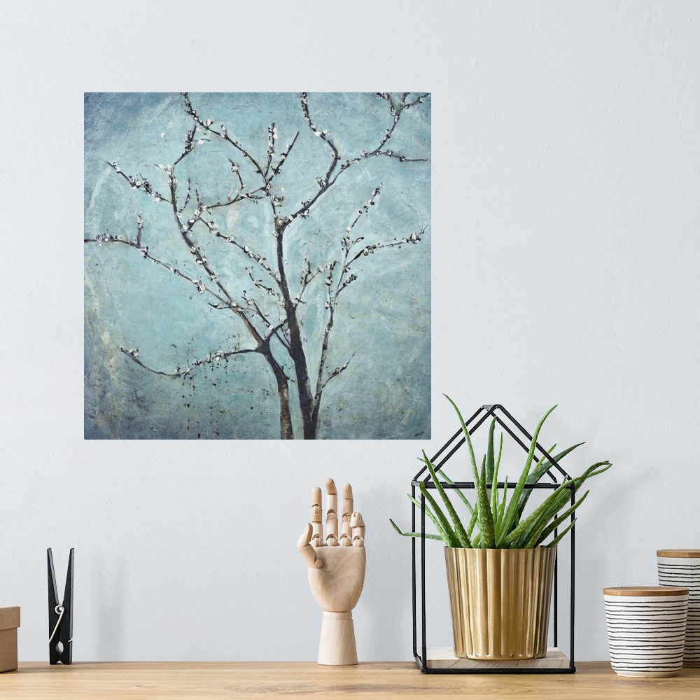A bohemian room featuring Contemporary painting of flowering branches against a hazy blue background.