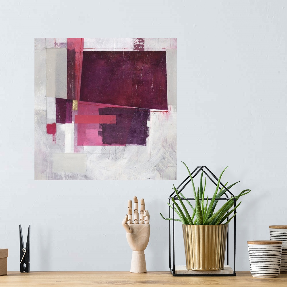 A bohemian room featuring Square abstract painting with rectangular shapes in shades of pink and purple with a single metal...