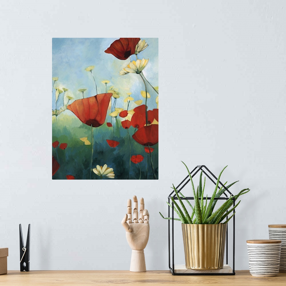 A bohemian room featuring Contemporary painting of red poppies in a green field with daisies, under a blue sky.