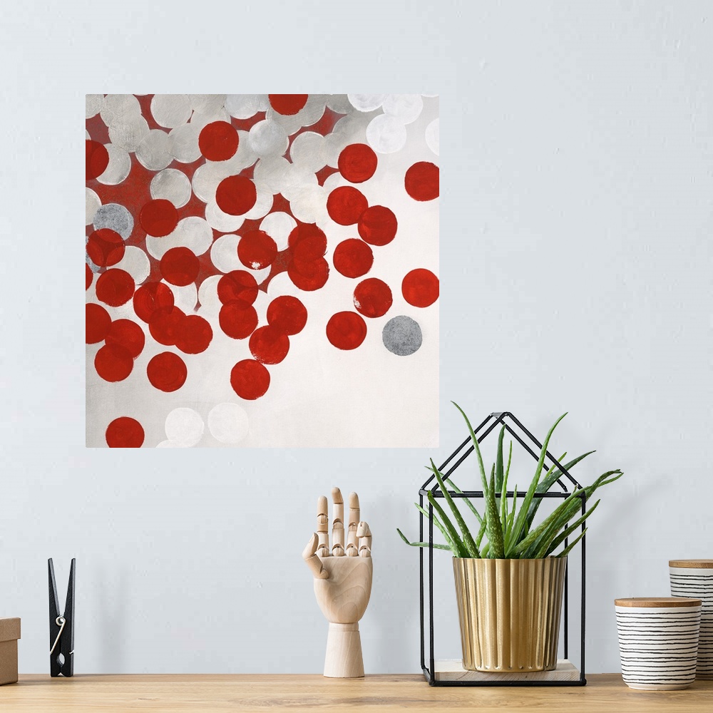 A bohemian room featuring Contemporary abstract artwork made of white and red dots.
