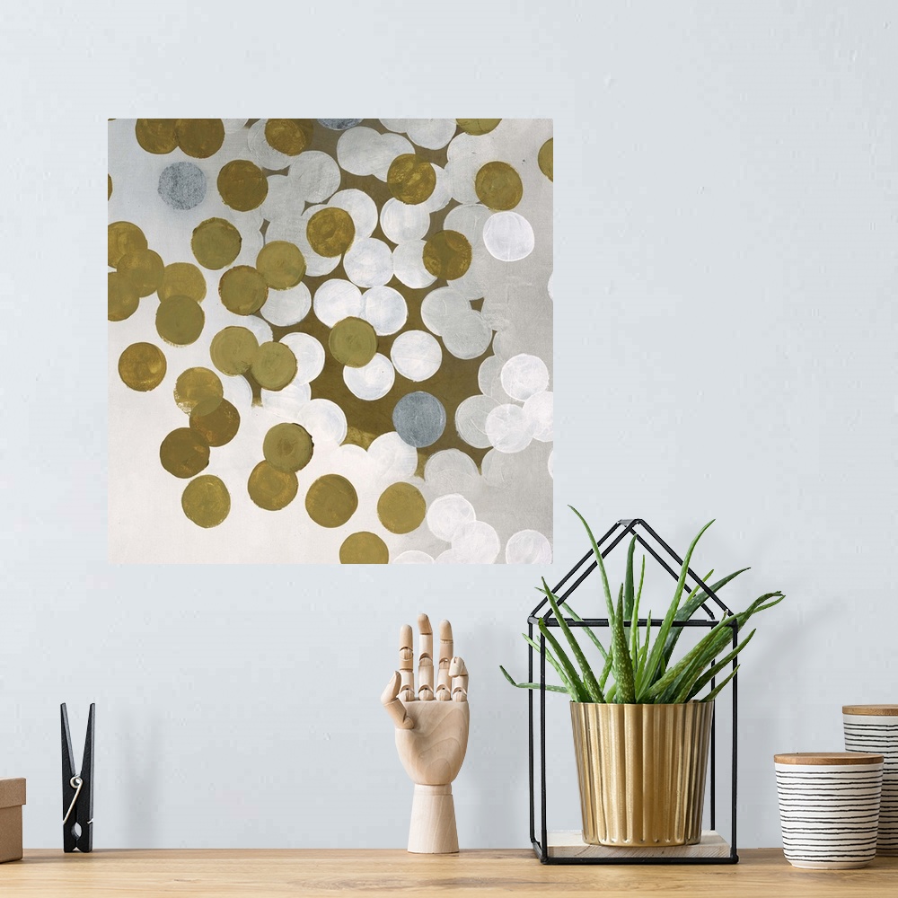 A bohemian room featuring Contemporary abstract artwork made of white and gold dots.