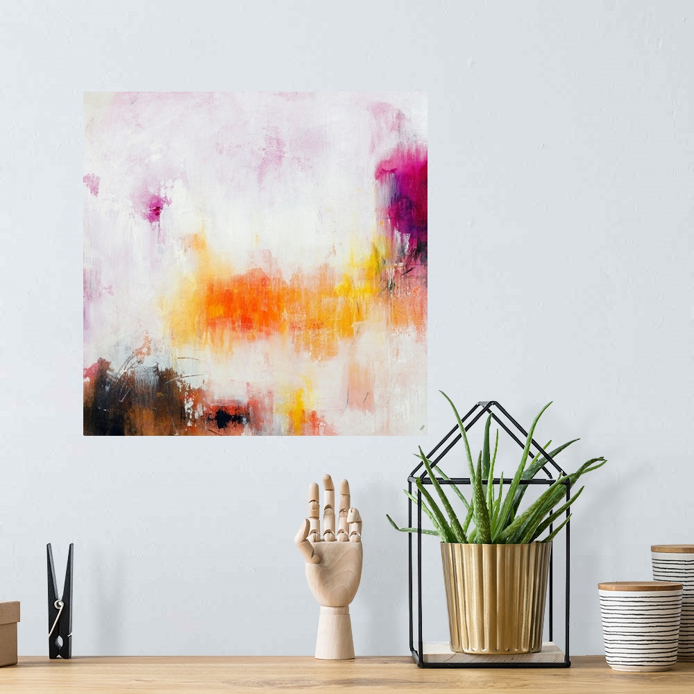A bohemian room featuring Large abstract painting in warm pink, purple, yellow, and orange hues on a square canvas.