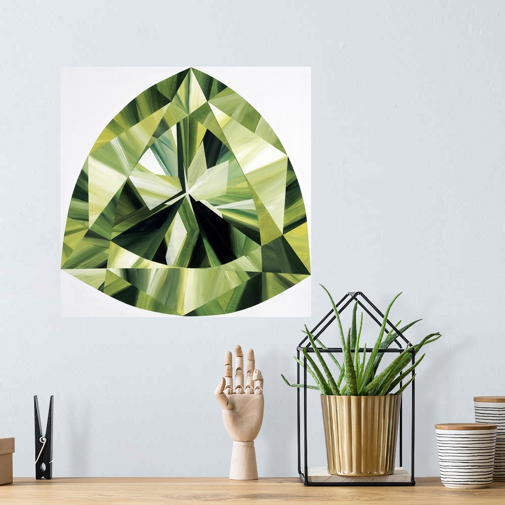 A bohemian room featuring A painting of a green, trilliant shaped gemstone.