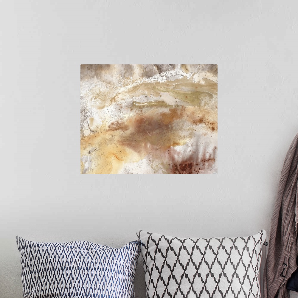 A bohemian room featuring An abstract painting of natural earth colors of brown and gold.
