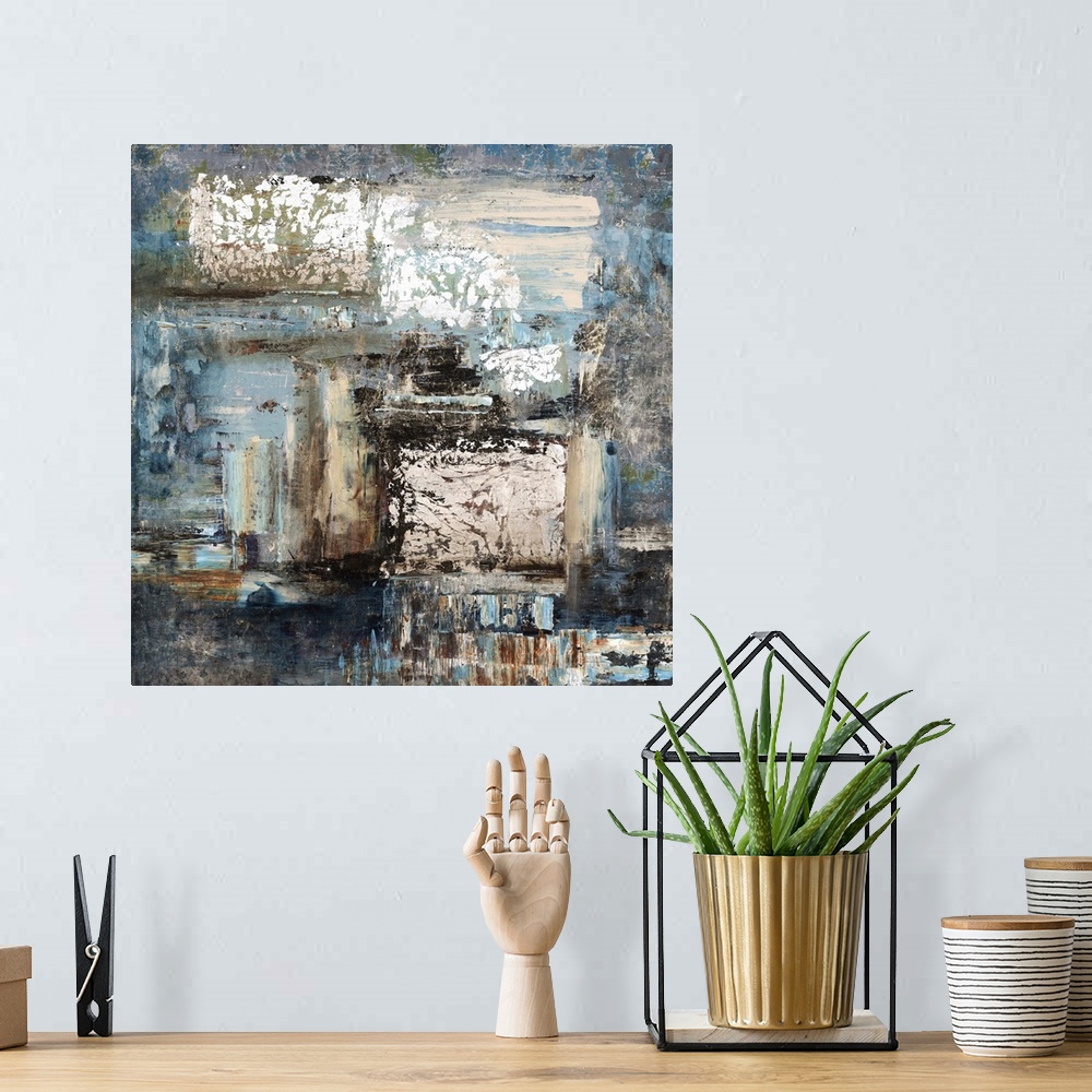 A bohemian room featuring Contemporary abstract painting of blue and neutral earth tones merging together.