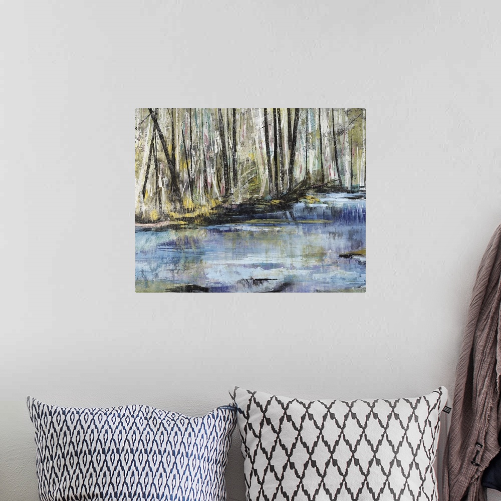 A bohemian room featuring Horizontal painting of a river flowing through a forest.