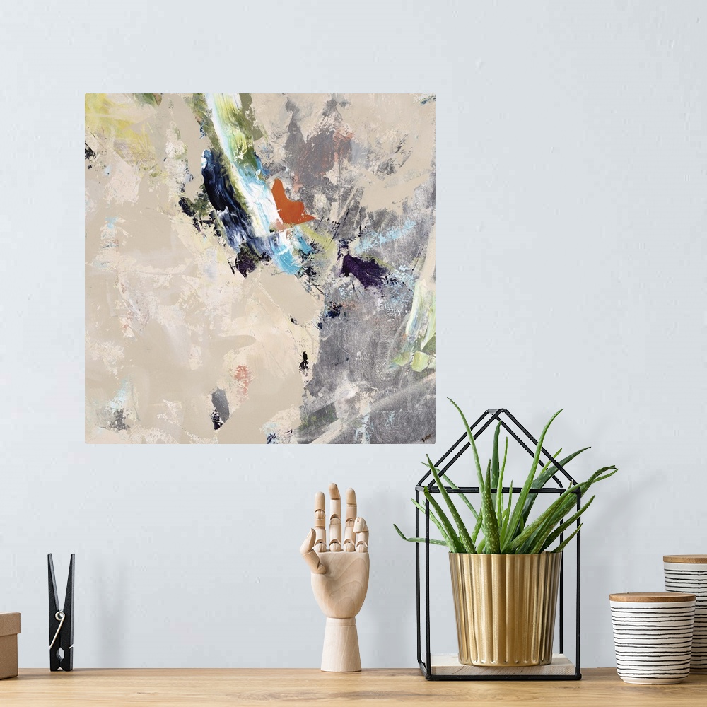 A bohemian room featuring Abstract painting of a large silver object surrounded my small shapes in various colors, on a lig...