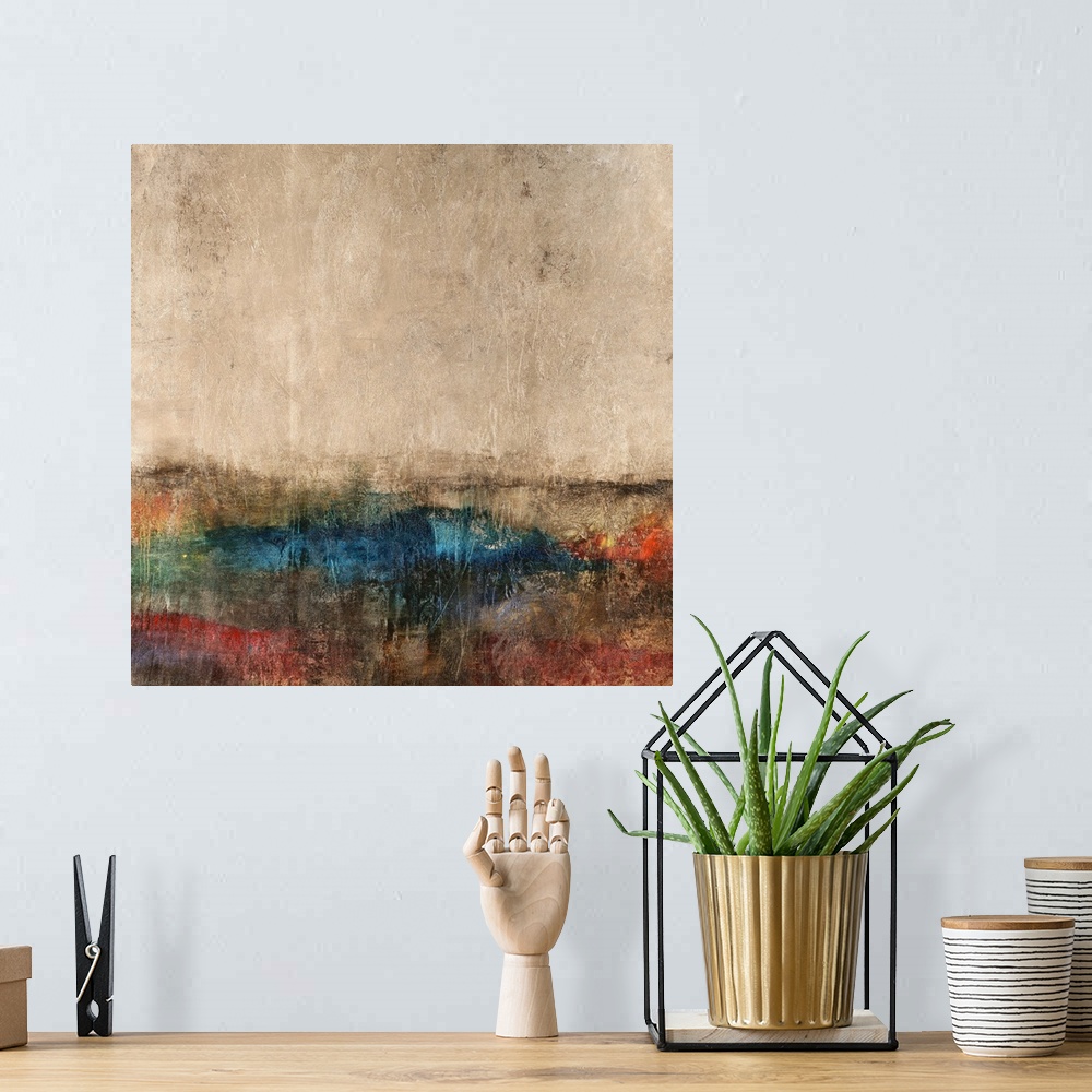 A bohemian room featuring Abstract painting of natural looking colors coming together to form what looks like a landscape.