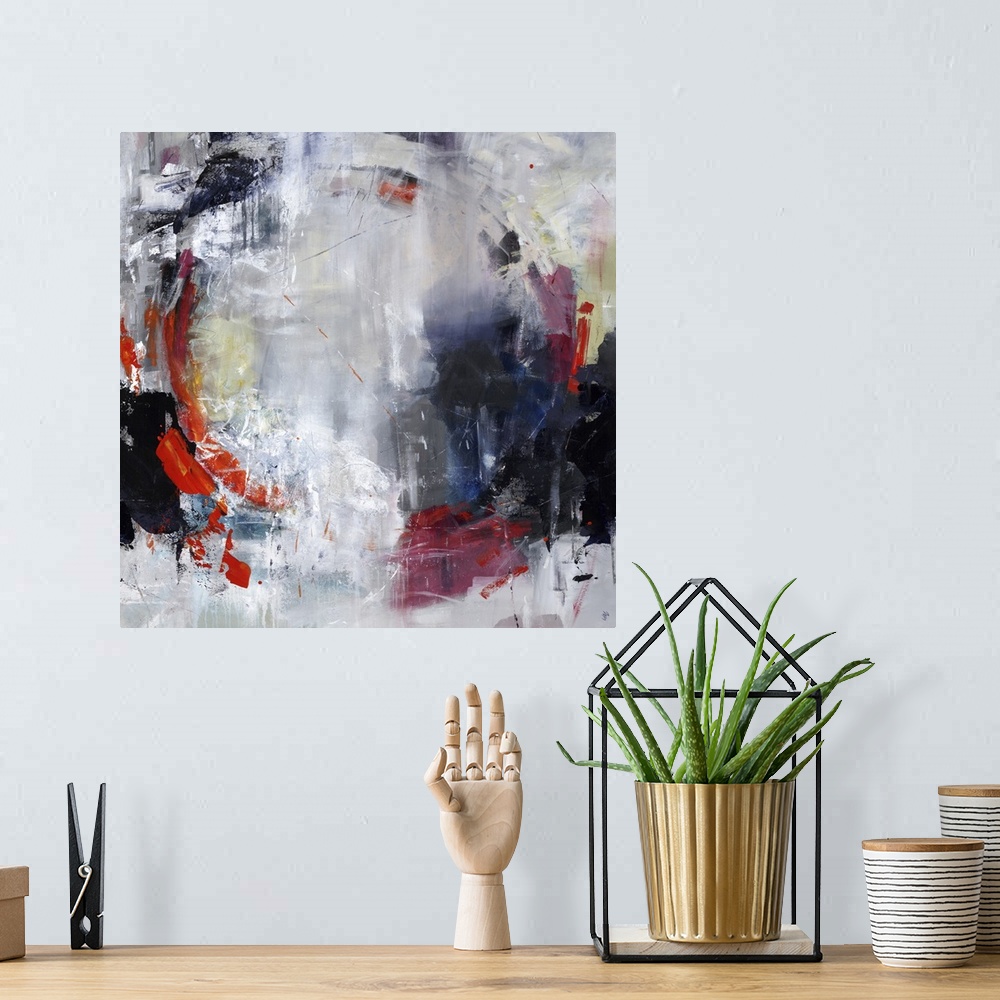 A bohemian room featuring Abstract painting of textured paint with a hint of a circle shape.