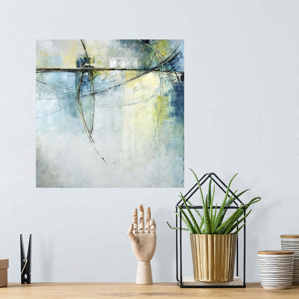 A bohemian room featuring Contemporary abstract painting of thin black lines against a faded green and blue background.