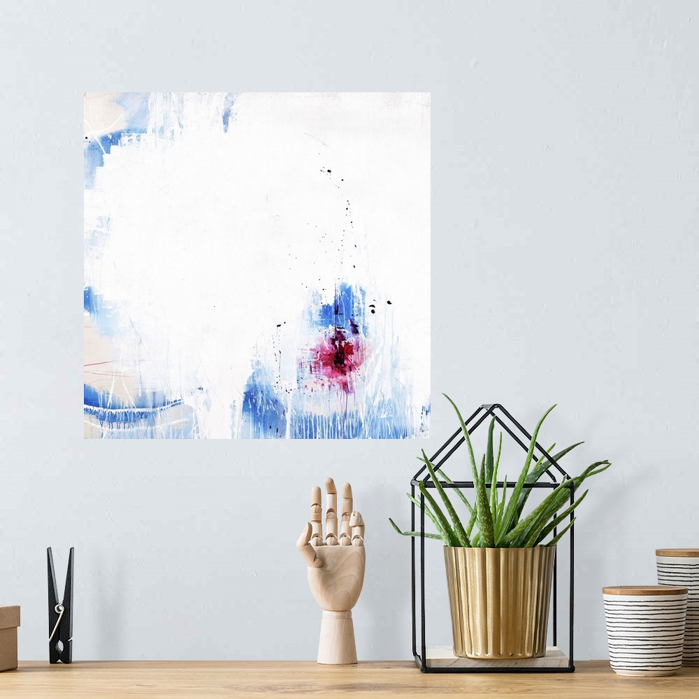 A bohemian room featuring A contemporary abstract painting of a vibrant blue and red against a white background.