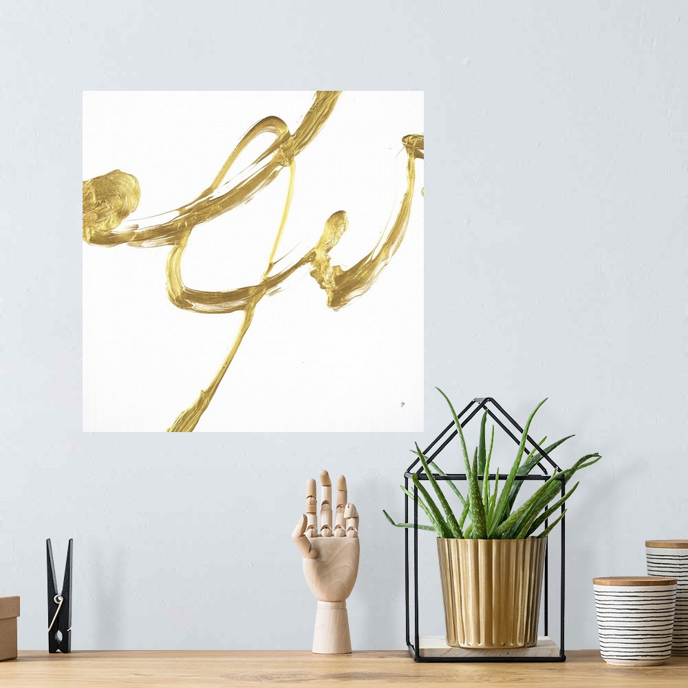 A bohemian room featuring Square minimalist abstract artwork with metallic gold brushstrokes on a white background.