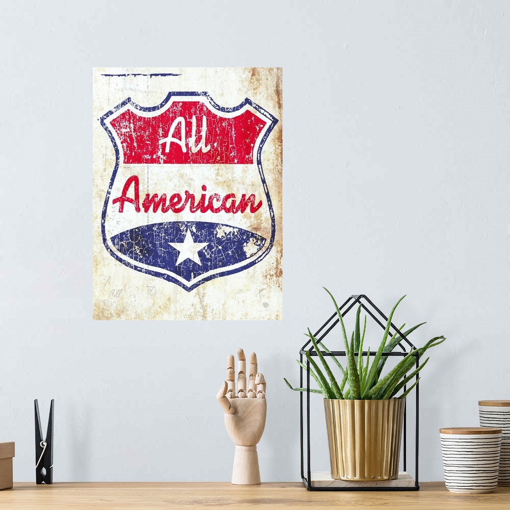 A bohemian room featuring A red, white and blue crest or shield with the words All American on an old aged, distressed, and...