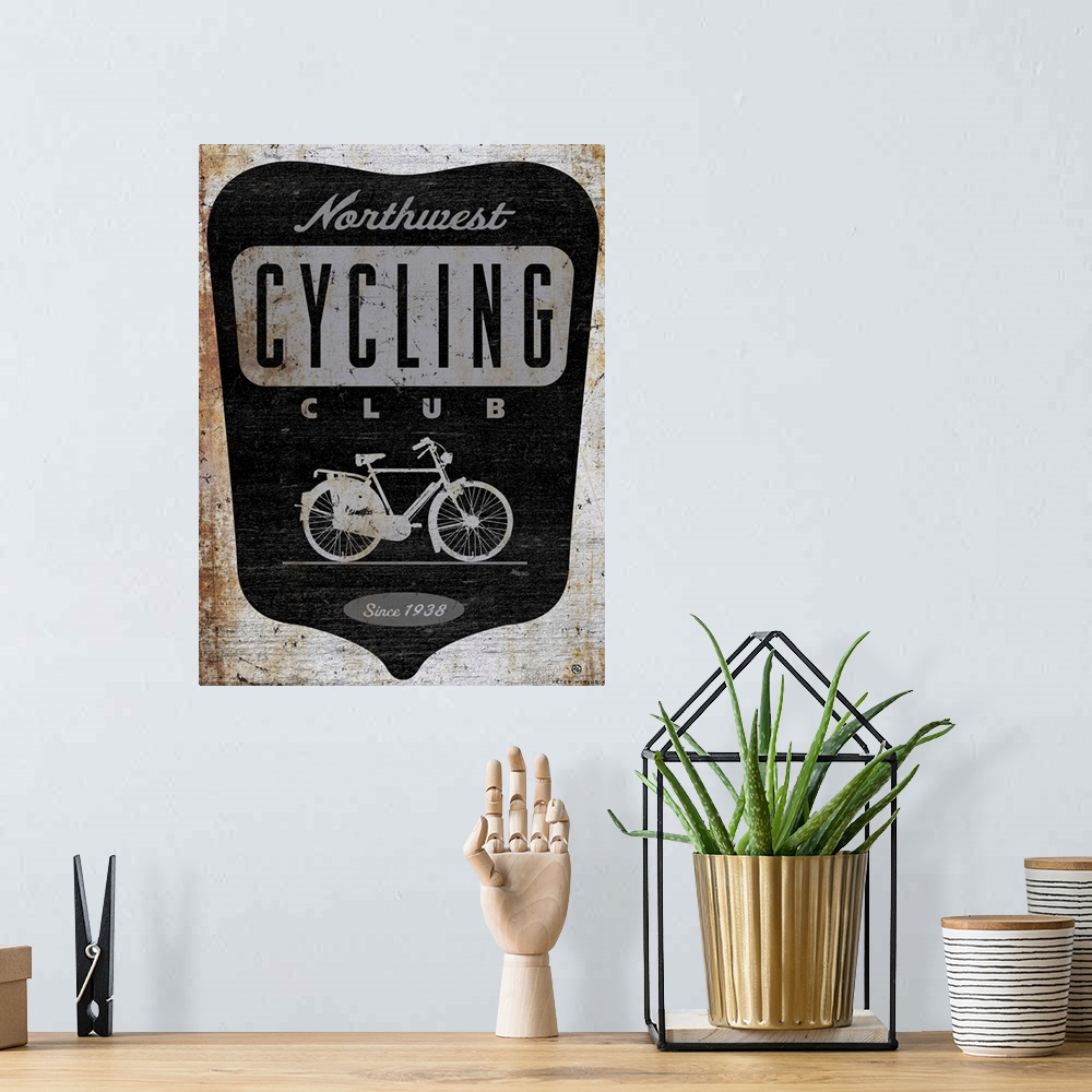 A bohemian room featuring Retro logo of the northwest cycling club depicting an old dutch opa bike.