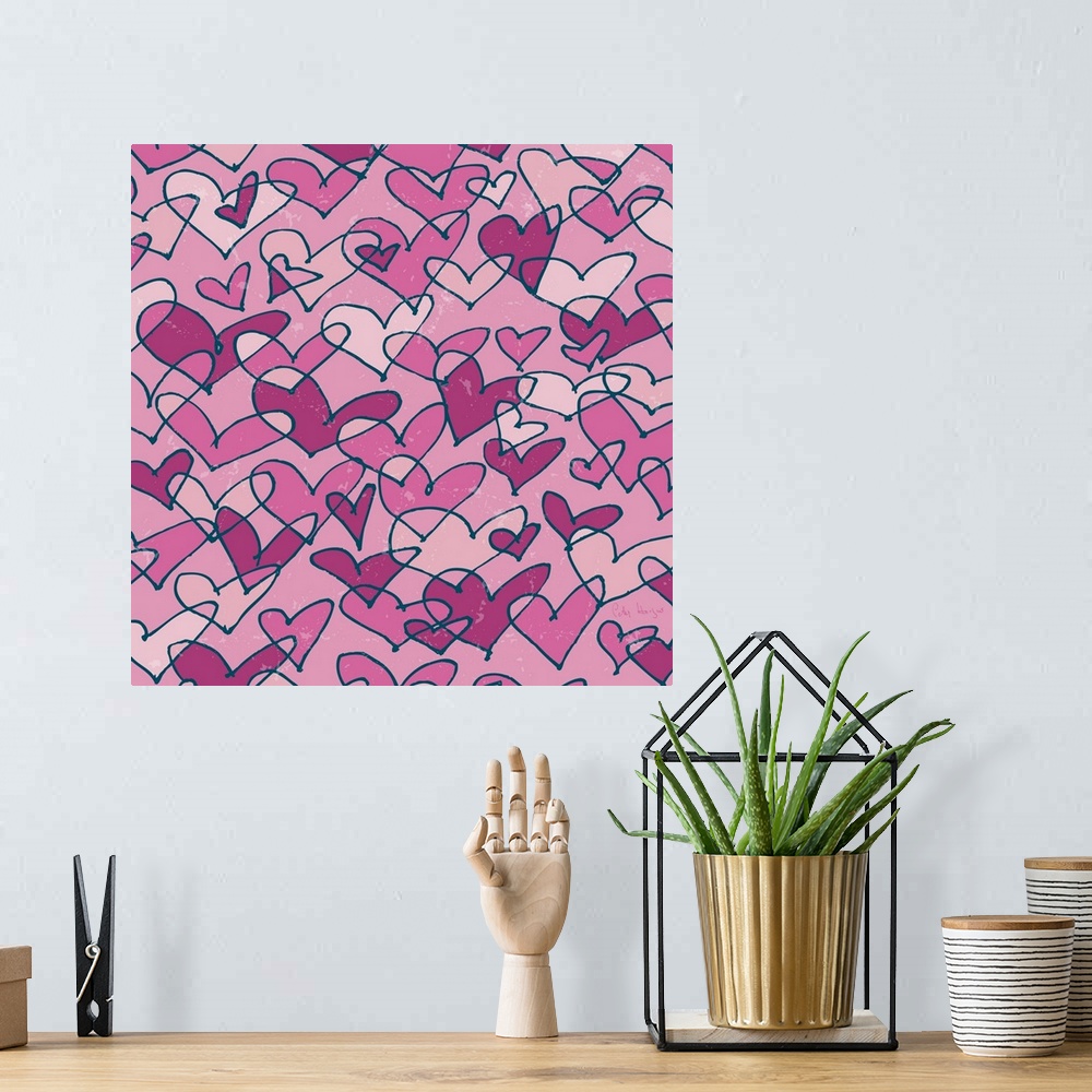 A bohemian room featuring A pattern of pen and ink illustrated pink hearts on a pink background.