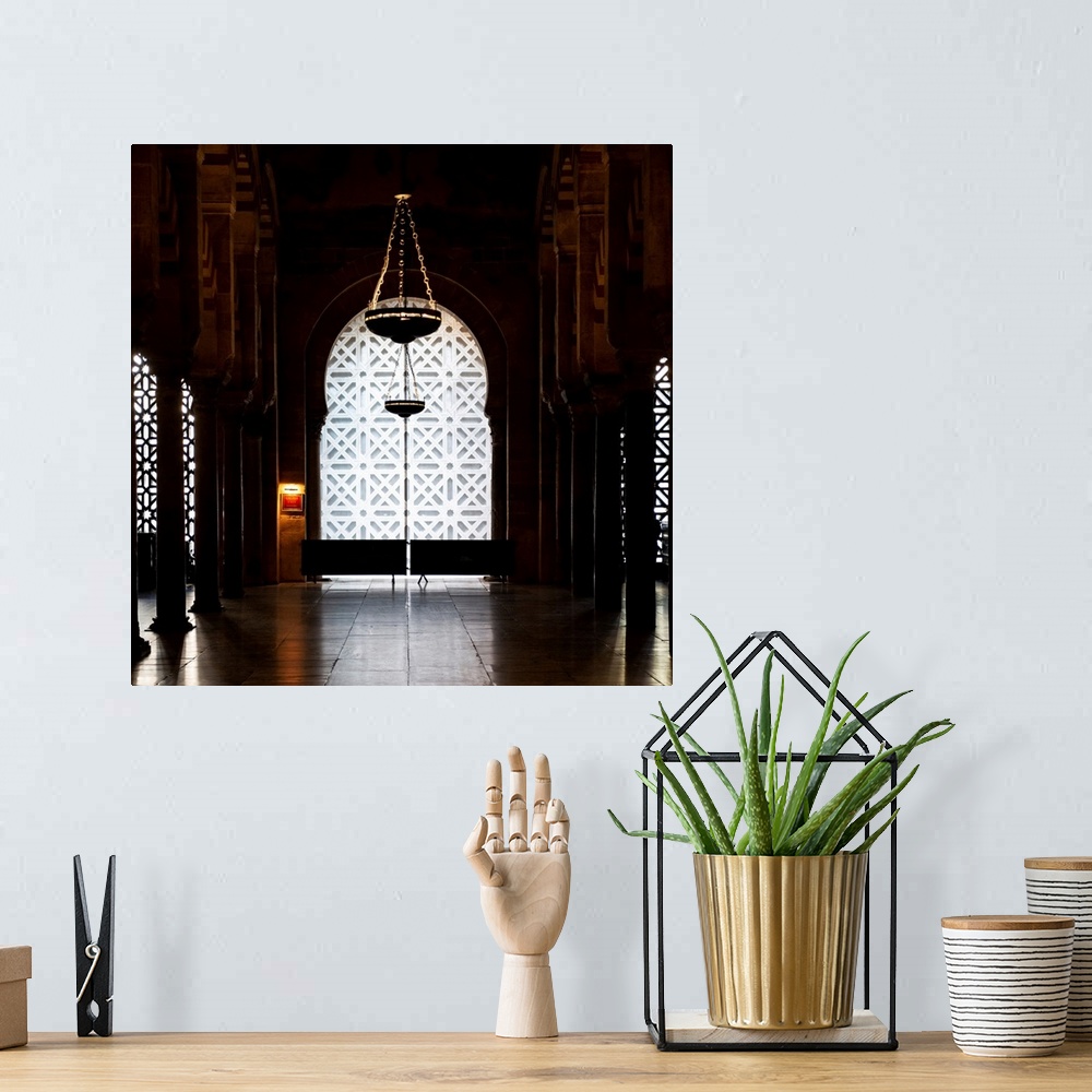 A bohemian room featuring It's a window overlooking the interior of the Mosque-Cathedral of Cordoba in Spain.