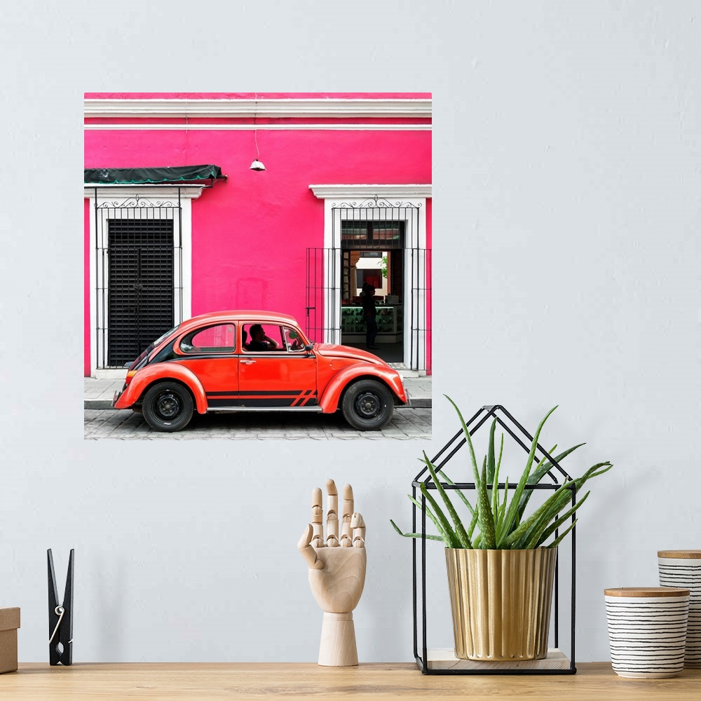 A bohemian room featuring Square photograph of a classic red Volkswagen Beetle parked in front of a pink building. From the...