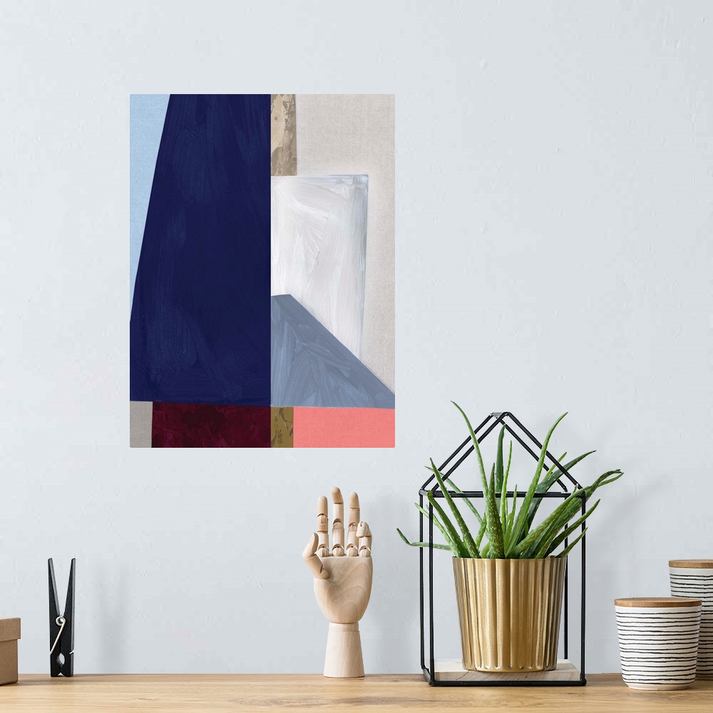 A bohemian room featuring Color block abstract artwork with shades of navy blue and coral pink.