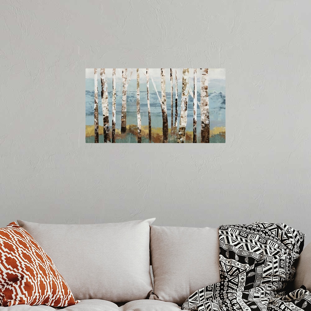 A bohemian room featuring Contemporary artwork of a row of white birch trees.