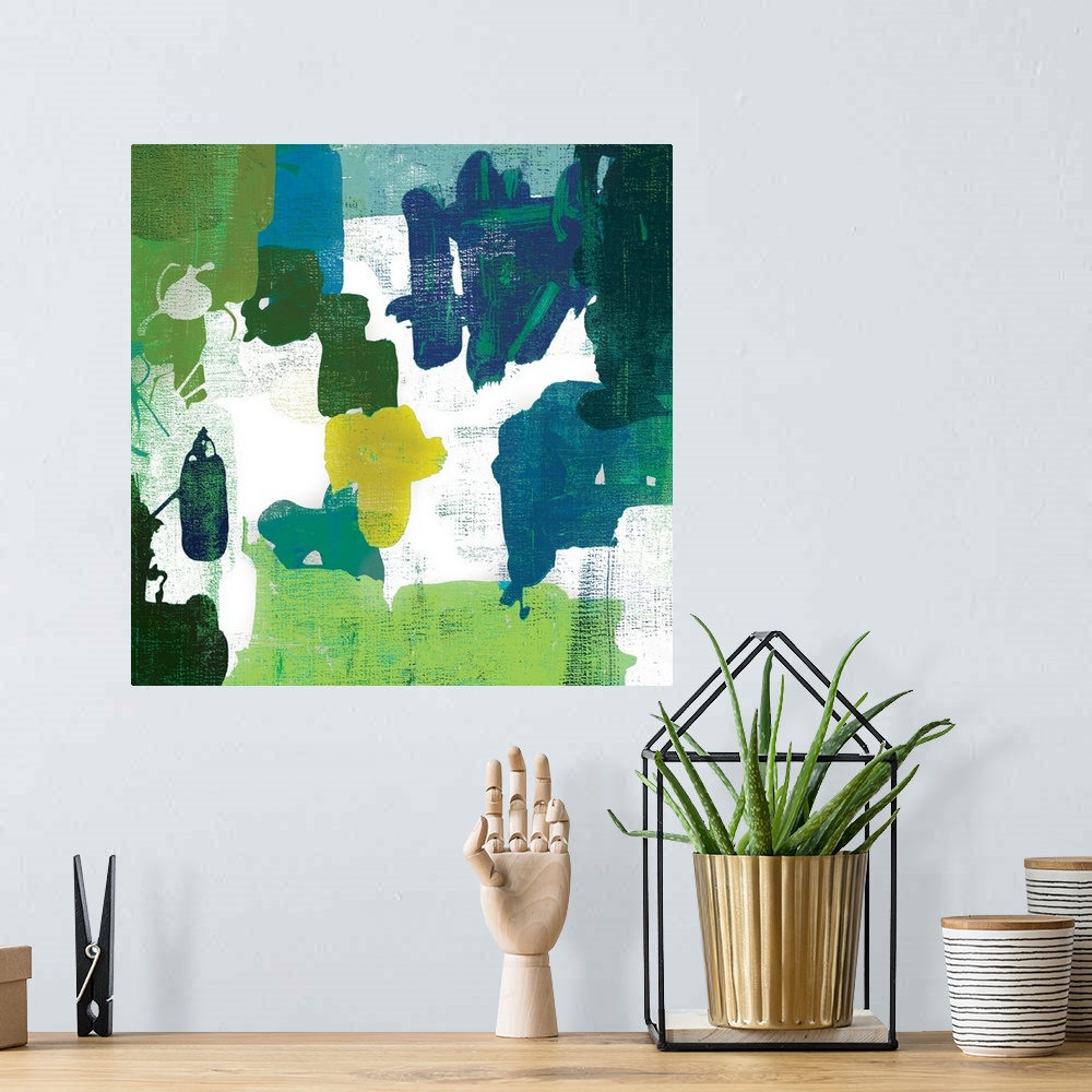A bohemian room featuring A contemporary painting of abstract shapes in varies shades of green.