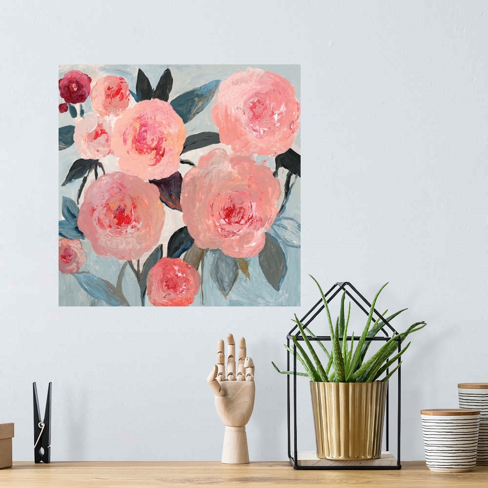 A bohemian room featuring A contemporary painting of large pink flower blooms against a neutral textured backdrop.