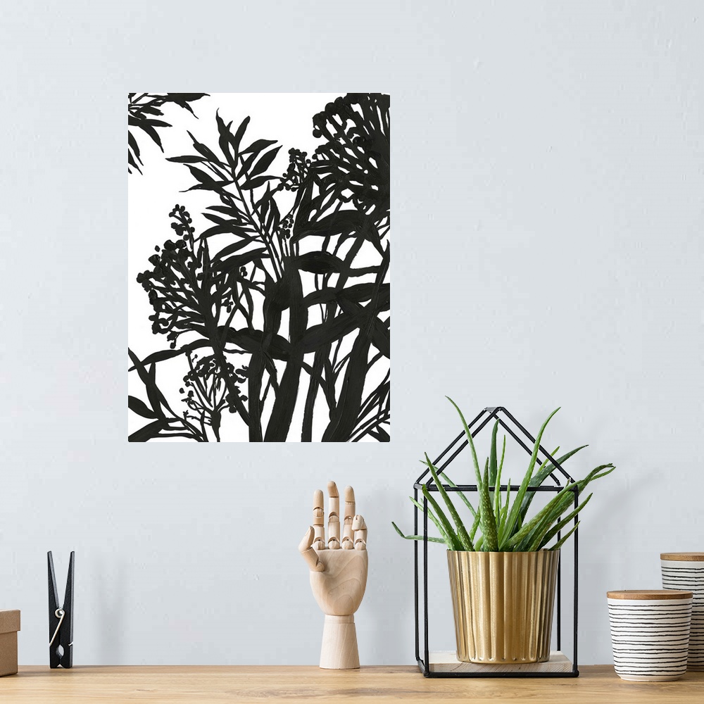 A bohemian room featuring Vertical painting of a flower arrangement in black and white.