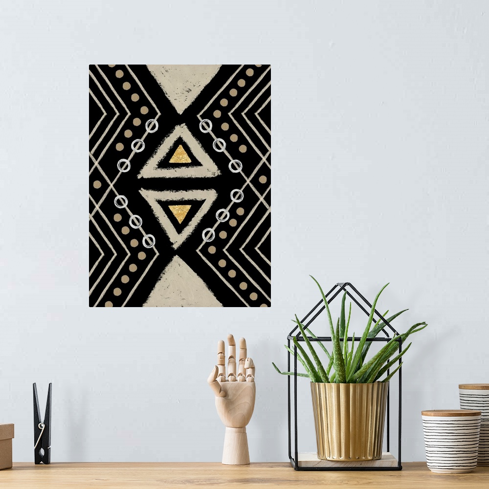 A bohemian room featuring Vertical abstract artwork with tribal-like designs and geometric shapes in brown, black, and gold...