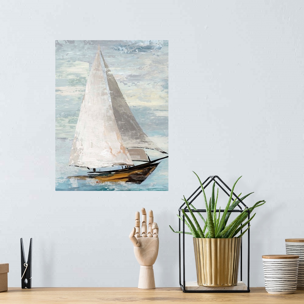 A bohemian room featuring Painting of a sailboat with full white sails.