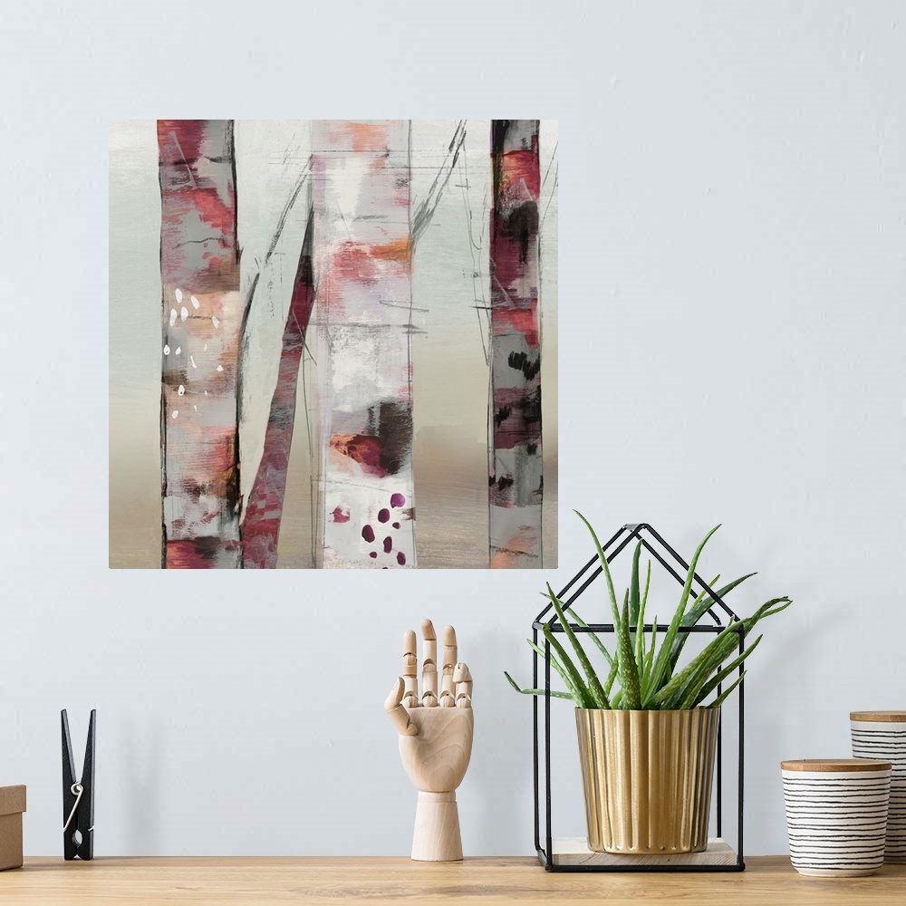 A bohemian room featuring Contemporary artwork of a small group of birch trees with pink shades.