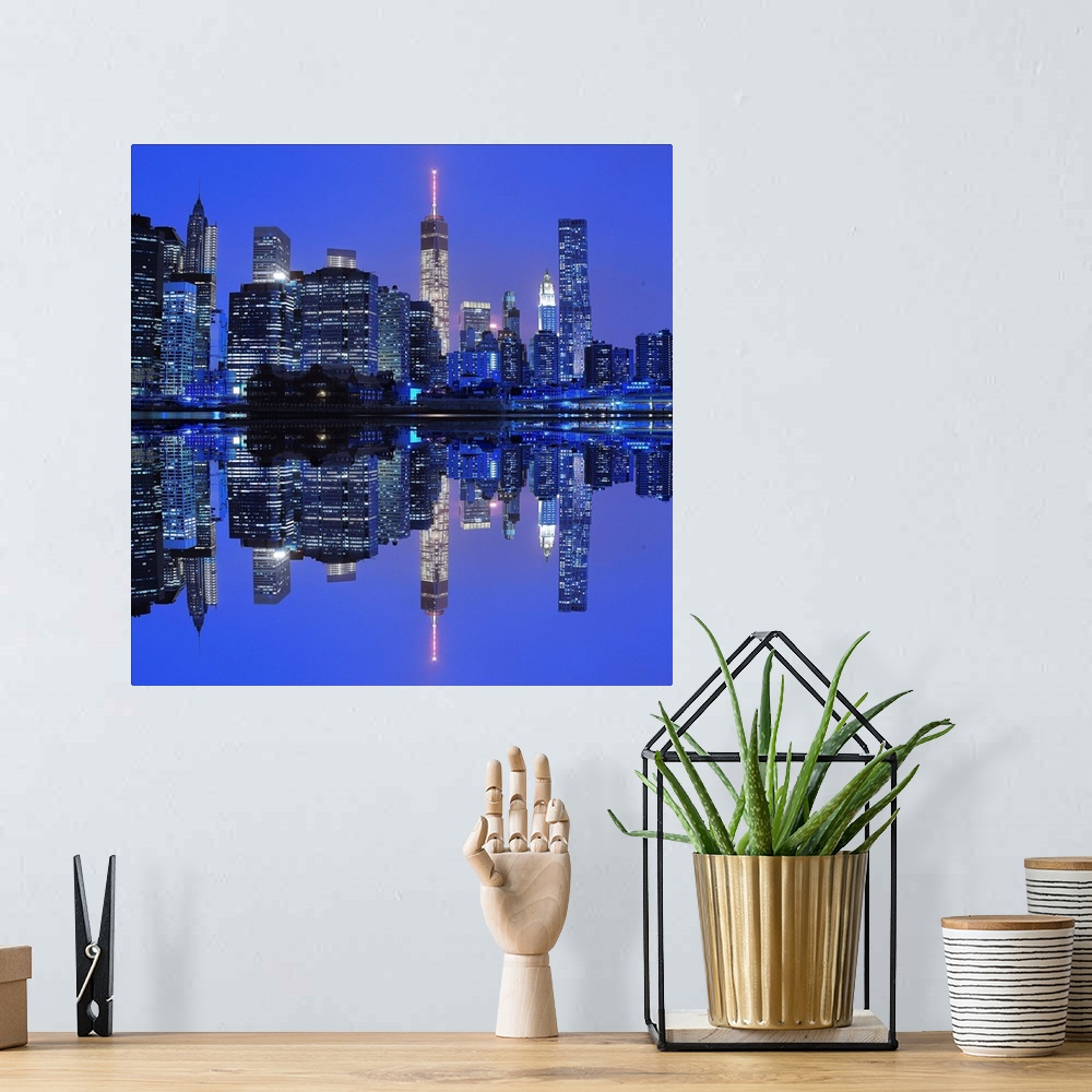 A bohemian room featuring New York City skyline at night, reflected in the bay below.