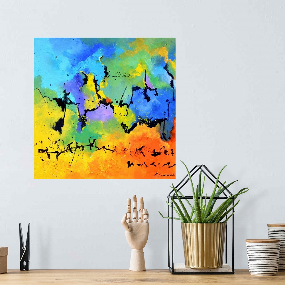 A bohemian room featuring A square abstract painting in vibrant shades of blue, green, orange and yellow with splatters of ...
