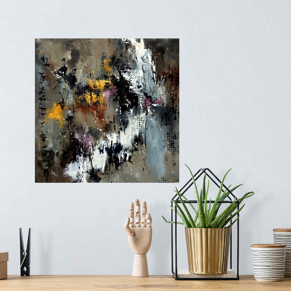 A bohemian room featuring A square abstract painting with shades of gray and brown with yellow accents.