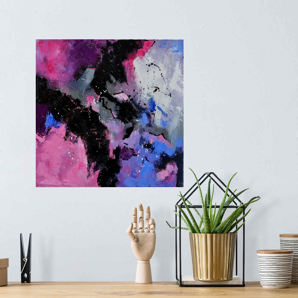 A bohemian room featuring A square abstract painting in dark shades of black, purple and pink with splatters of paint overl...