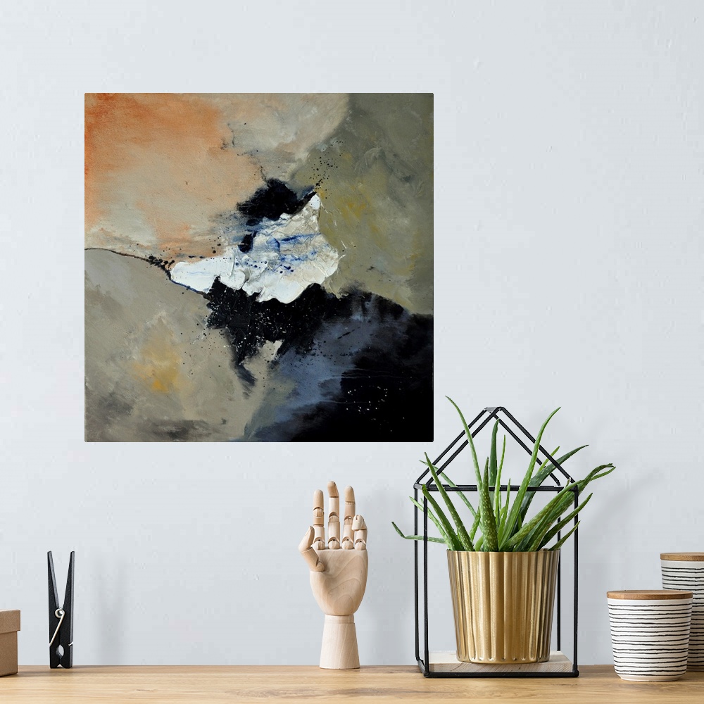 A bohemian room featuring A square abstract painting in dark colors of black, orange, white and gray with splatters of pain...