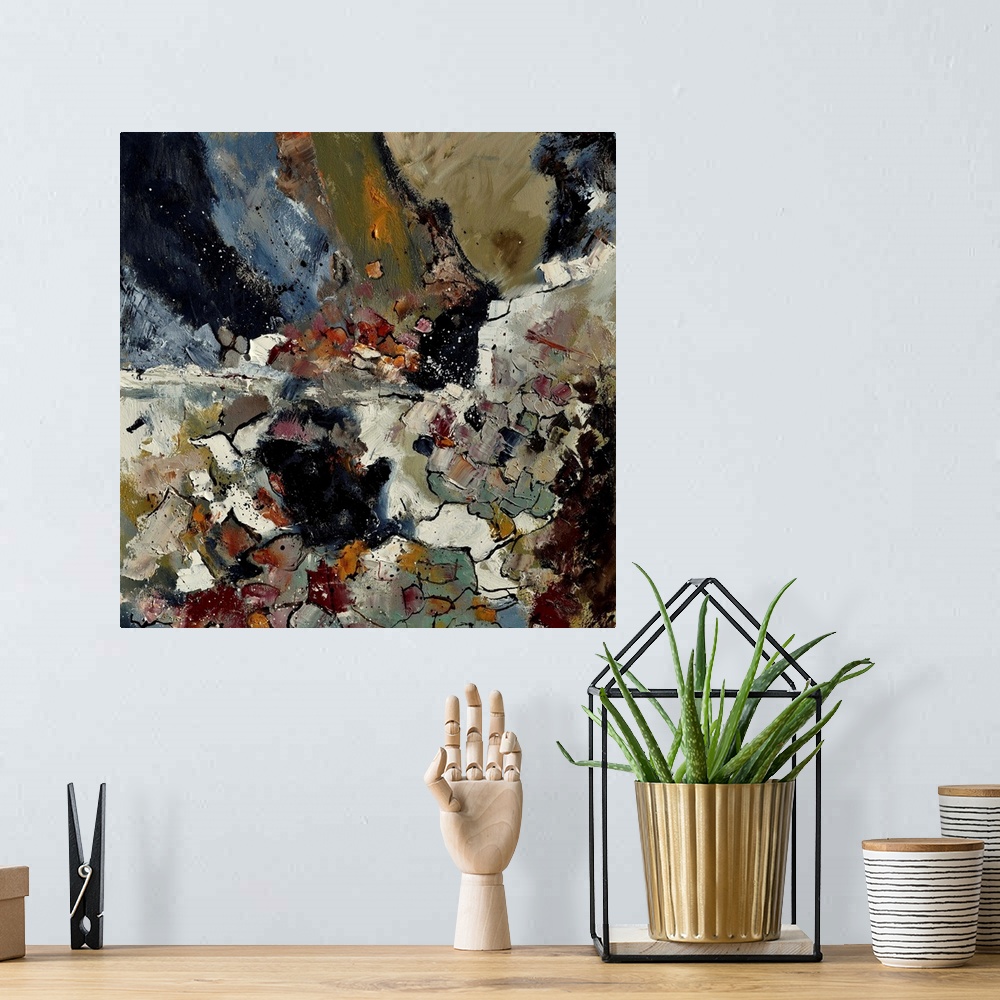 A bohemian room featuring A square abstract painting in dark shades of black, brown, white and gray with splatters of paint...