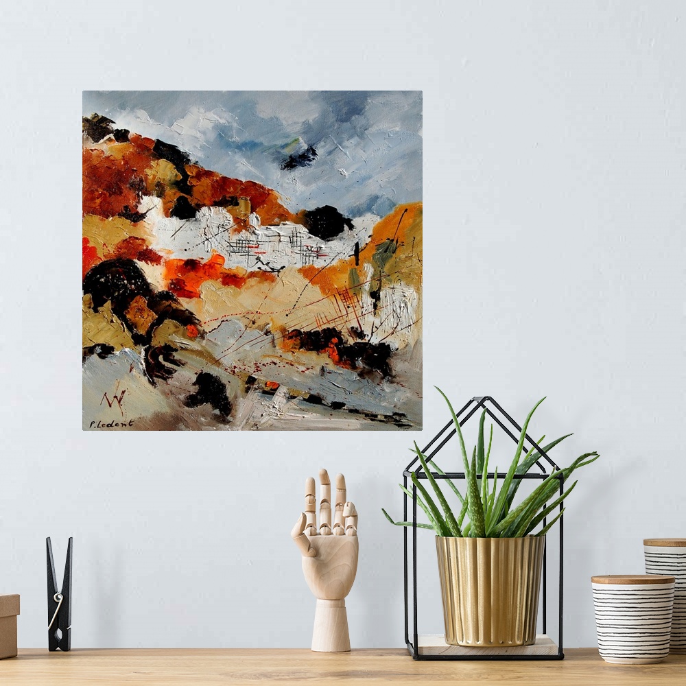 A bohemian room featuring A vertical abstract painting with muted colors of gray, brown and orange.