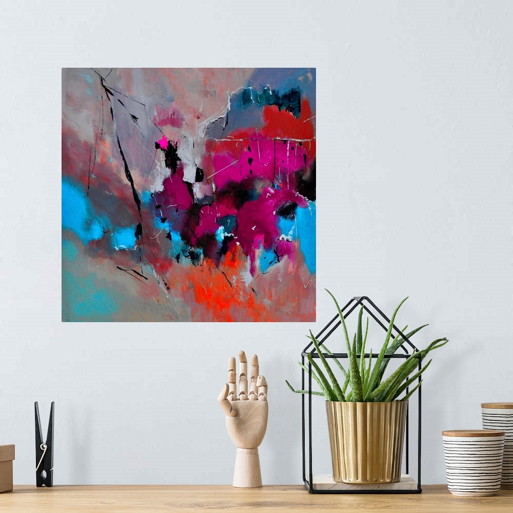 A bohemian room featuring Abstract painting with vibrant hues in shades of orange, blue, pink, red and gray mixed in with b...