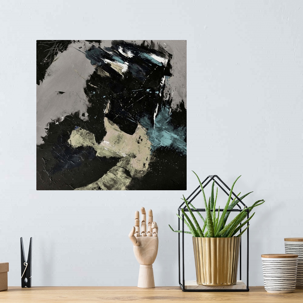 A bohemian room featuring A square abstract painting in textured shades of black, brown and gray with splatters of paint ov...