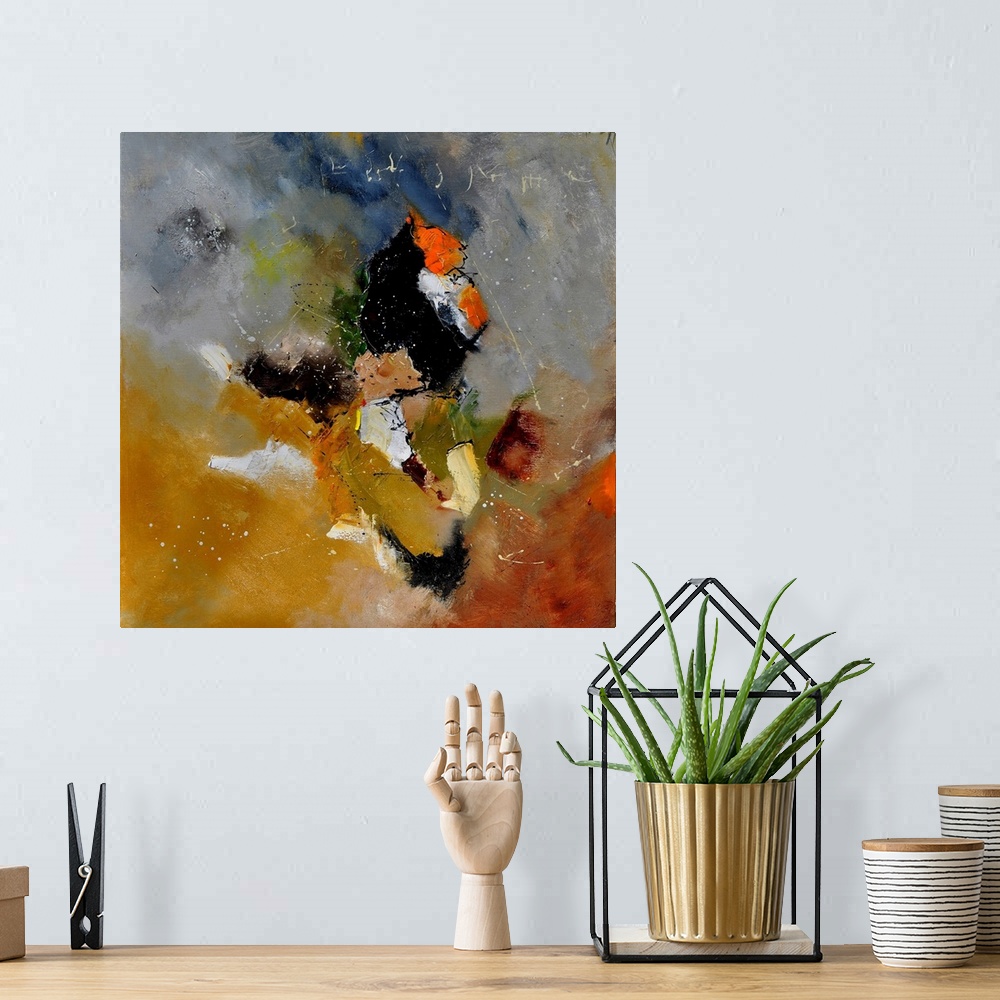 A bohemian room featuring Abstract painting in shades of orange, yellow, gray and white mixed in with black contrasting des...