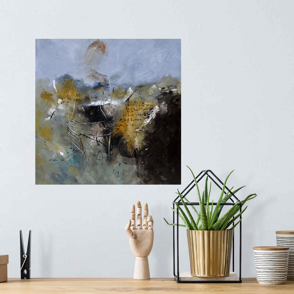 A bohemian room featuring A square abstract painting in dark shades of black, gray, white and yellow with splatters of pain...