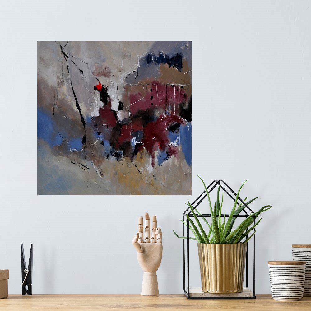 A bohemian room featuring A square abstract painting in dark textured shades of brown, blue and gray with splatters of pain...