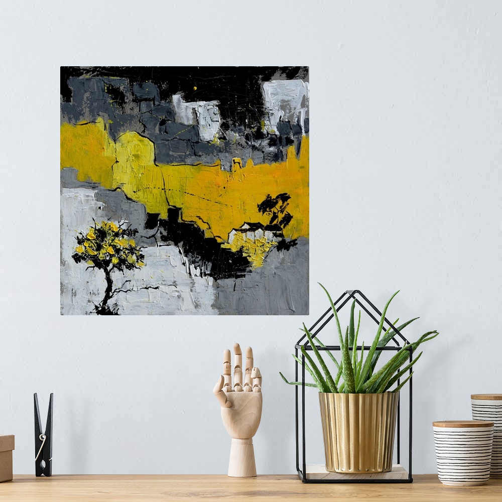 A bohemian room featuring A square abstract painting in textured shades of black, gray and yellow with splatters of paint o...