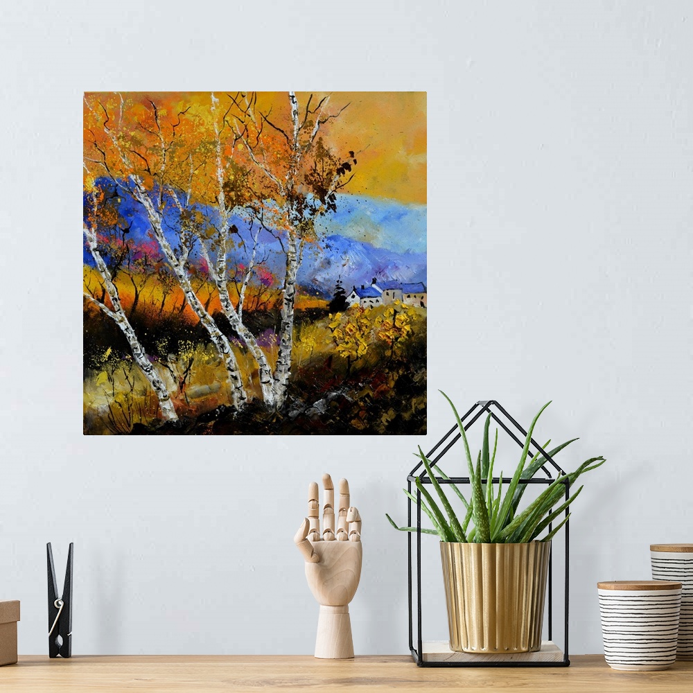 A bohemian room featuring Square painting of an Autumn landscape with orange and yellow leaves on trees in the foreground a...