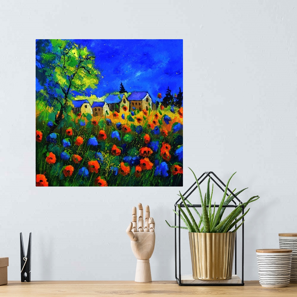 A bohemian room featuring Vibrant painting of a bright Summer day with blossoming poppies, a colorful sky, and a village in...
