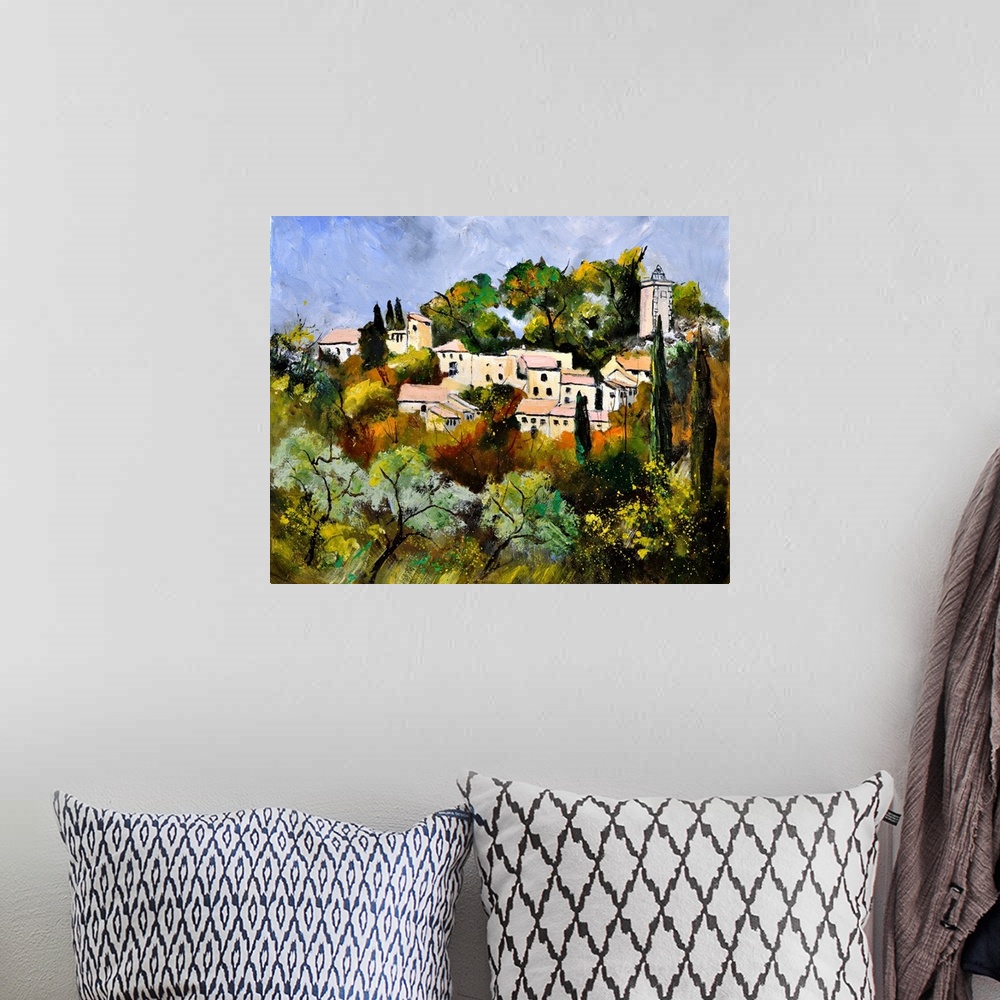 A bohemian room featuring Painting of a tree filled landscape in the foreground and a French village in the background with...